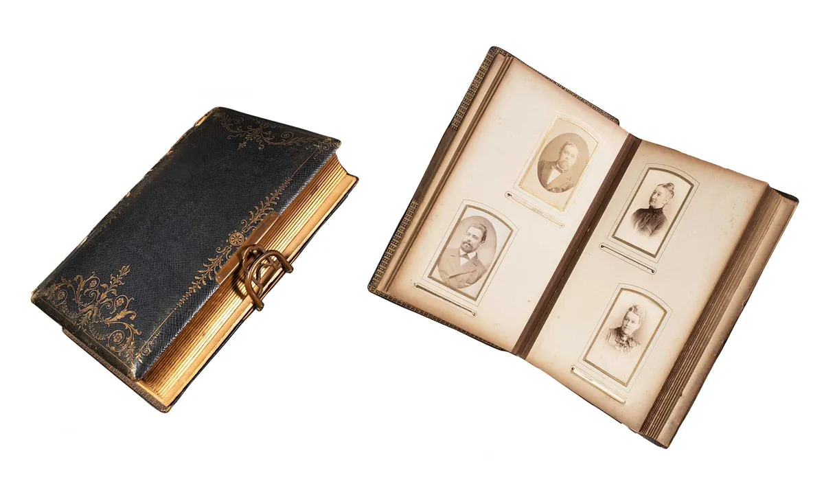 A leather-bound Victorian photograph album, closed and open at a page of portraits