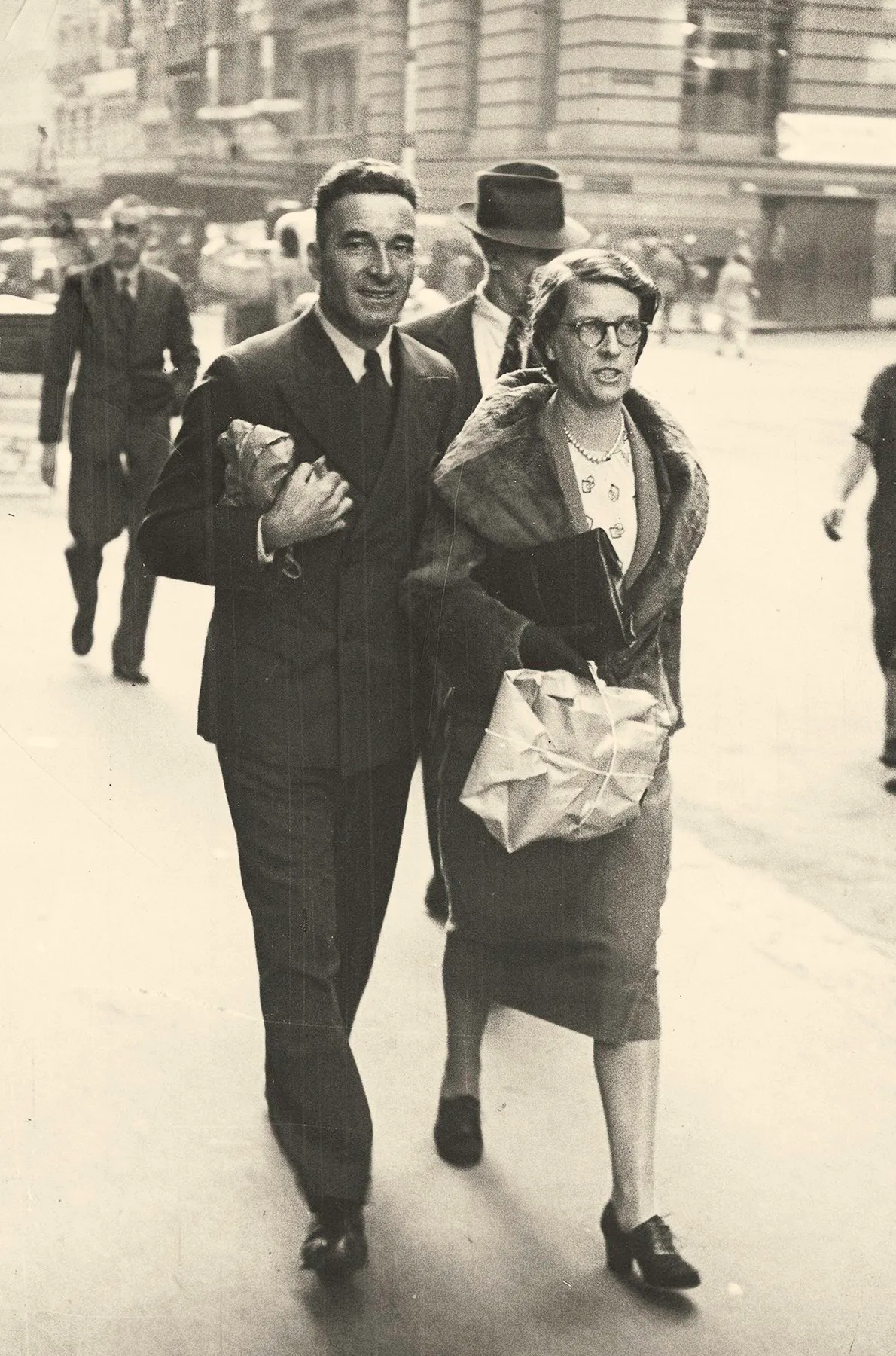 A couple walking along a Melbourne street, photographed by a street photographer